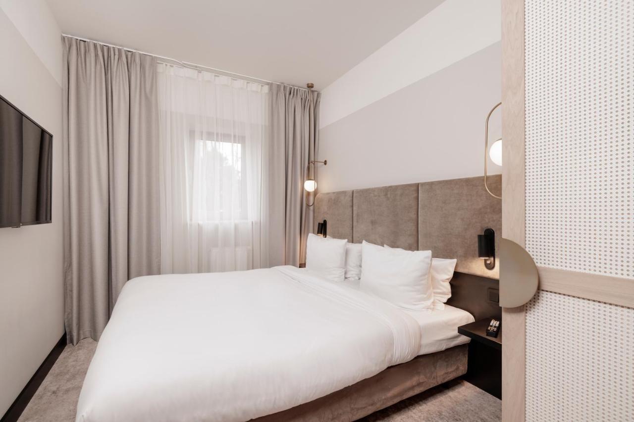 Royal Tulip Sand Колобжег Екстериор снимка A bedroom at the hotel
